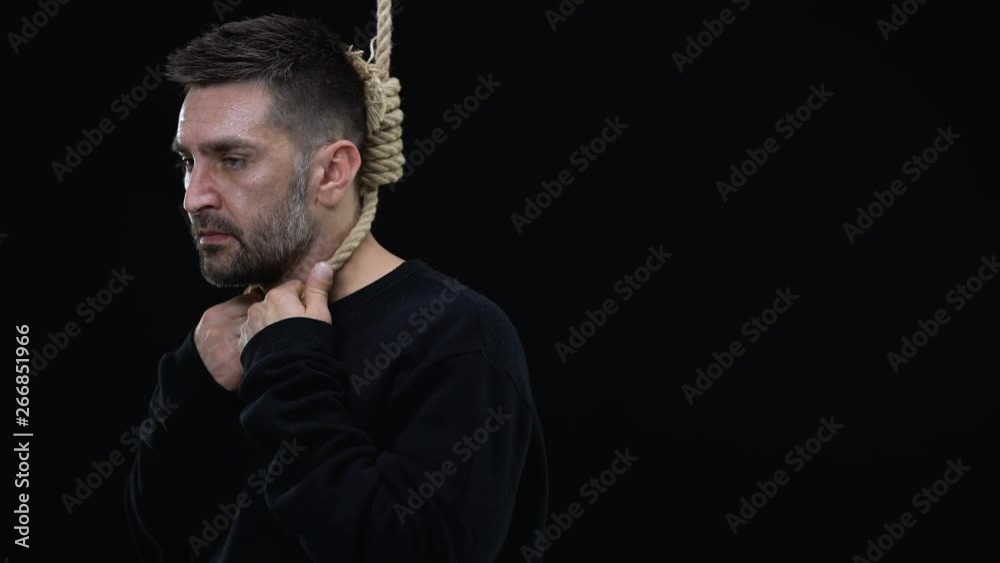 Disappointed man in rope noose on black background, life crisis, depression Disappointed man in rope noose on black background, life crisis, depression