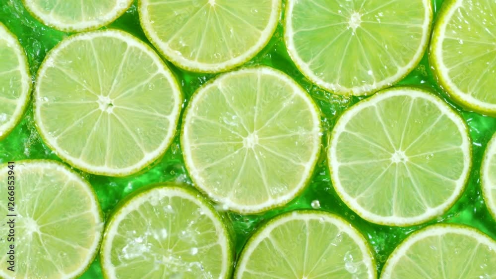 Super Slow Motion Shot of Splashing Water to Lime Slices at 1000fps. Super Slow Motion Shot of Splashing Water to Lime Slices at 1000fps.