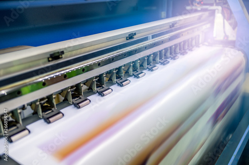 Large inkjet printer with printing on vinyl paper with lighting