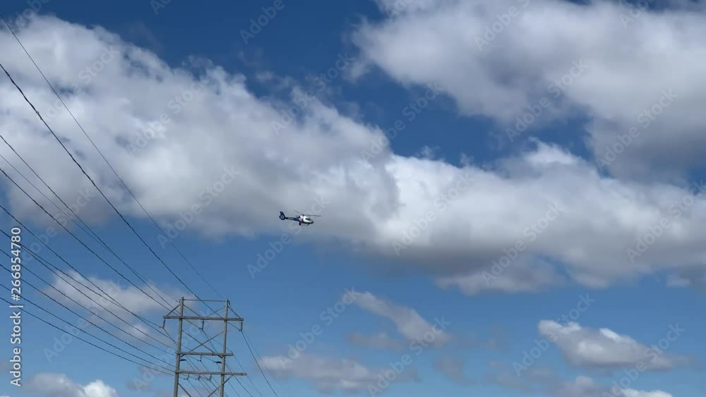 lifeflight helicopter flying in the beatiful cloudy sky lifeflight helicopter flying in the beatiful cloudy sky