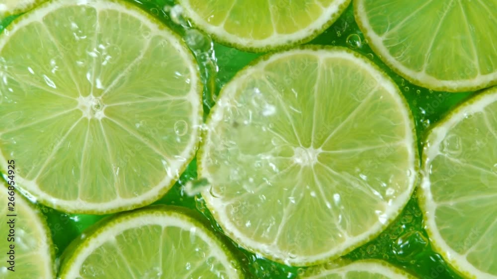 Super Slow Motion Shot of Splashing Water to Lime Slices at 1000fps.