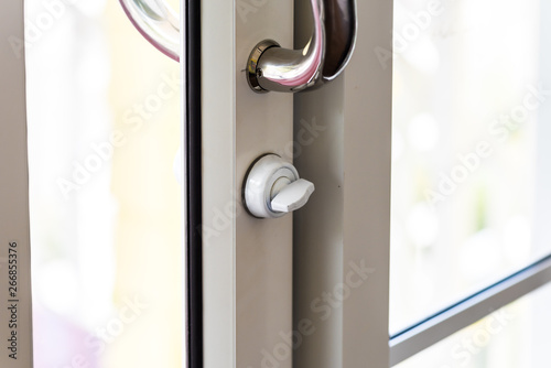 metal door handle and white latch
