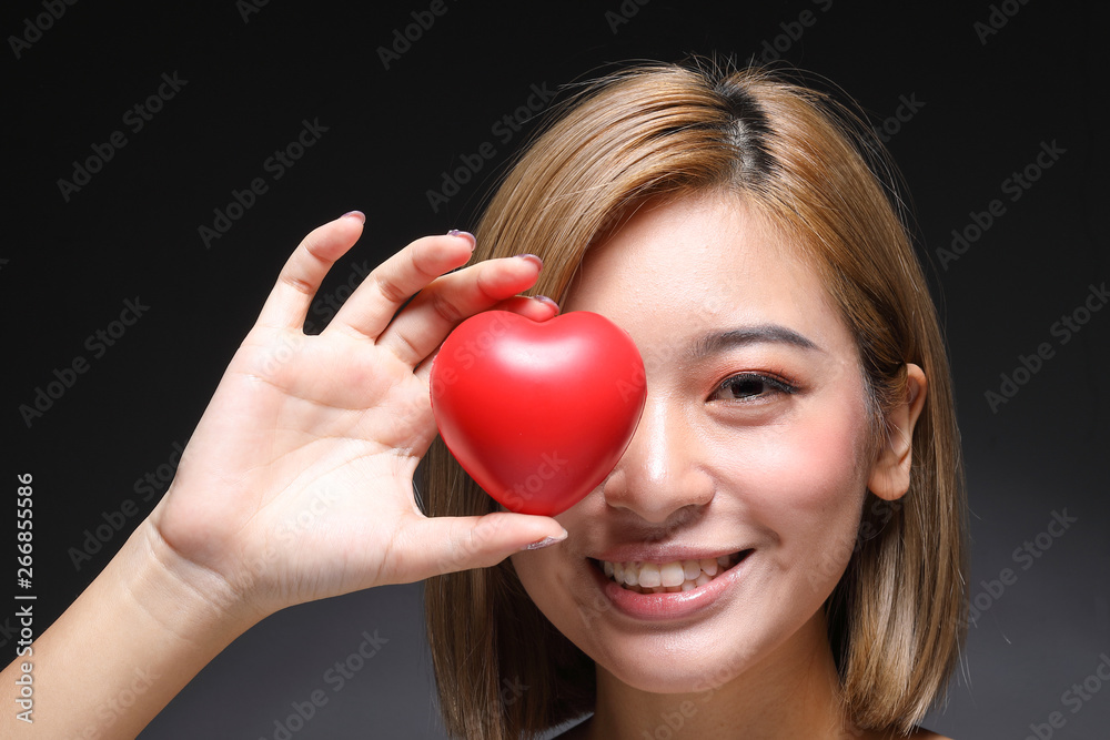 Young beautiful Asian woman makeup dark background Young beautiful Asian woman makeup dark background