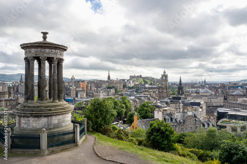 EDINBURGH, SCOTLAND - JUN12, 2017: People travel to see view of Edinburgh city on Dugald Stewart Monument at dusk.