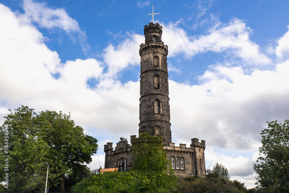 EDINBURGH, SCOTLAND - JUN12, 2017: People travel to visit Calton Hill in the center of the capital city and the old town of Edinburgh. It is a view point of Scotland city.
