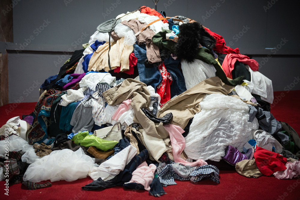 Pile of old worn clothes - obrazy, fototapety, plakaty 
