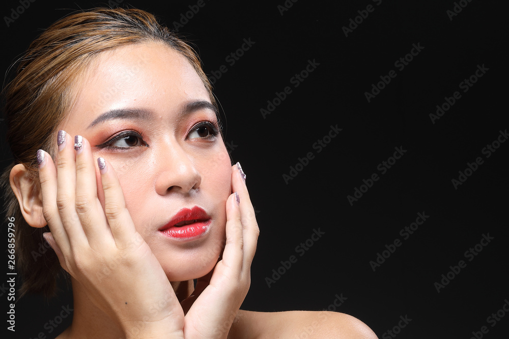 Young beautiful Asian woman makeup dark background Young beautiful Asian woman makeup dark background