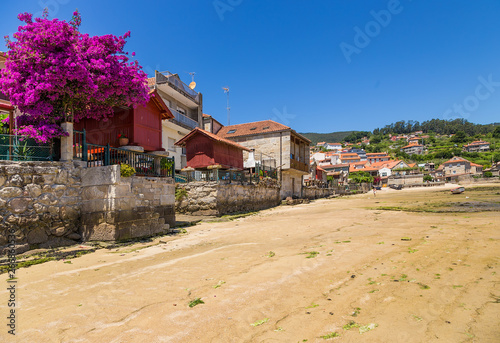 Combarro, Spain. The picturesque embankment of the town with traditional barns of horreos