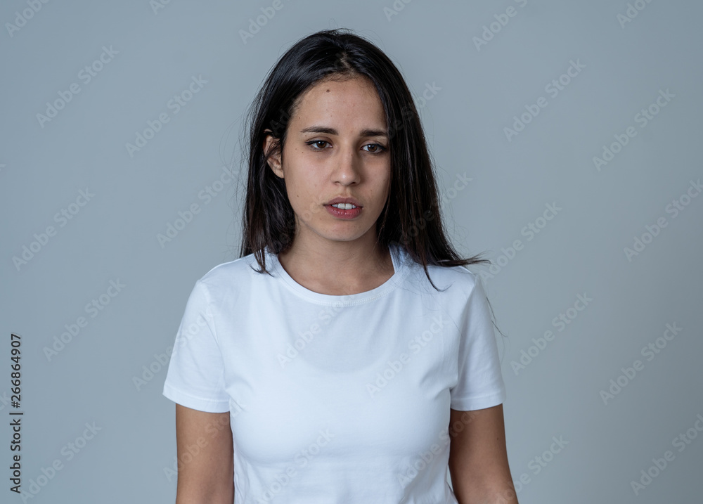 Portrait of sad and depressed woman. Isolated on neutral background. Human expressions and emotions Portrait of sad and depressed woman. Isolated on neutral background. Human expressions and emotions