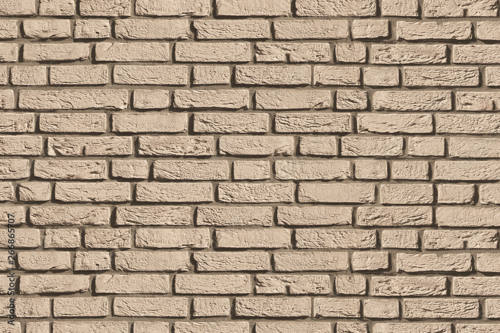 Obraz premium beige light brown brick bricks stone mortar stucco wall background backdrop surface