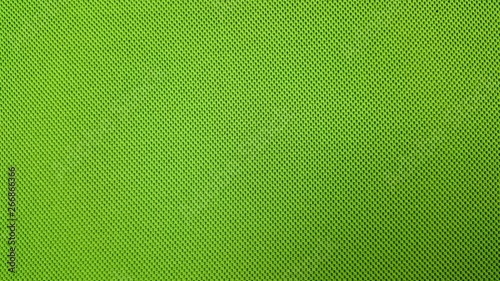 Green background textile material with pattern, closeup.