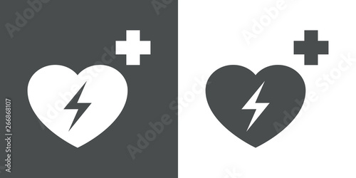 Icono plano símbolo desfibrilador en gris y blanco
