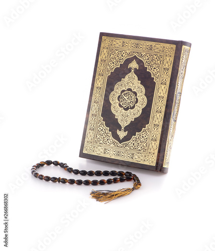 Holy Quran Book and Rosary Isolated on White Background