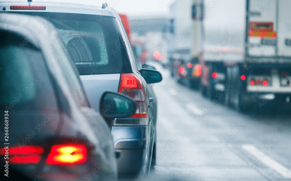 Traffic jam cars and trucks on road highway Traffic jam cars and trucks on road highway