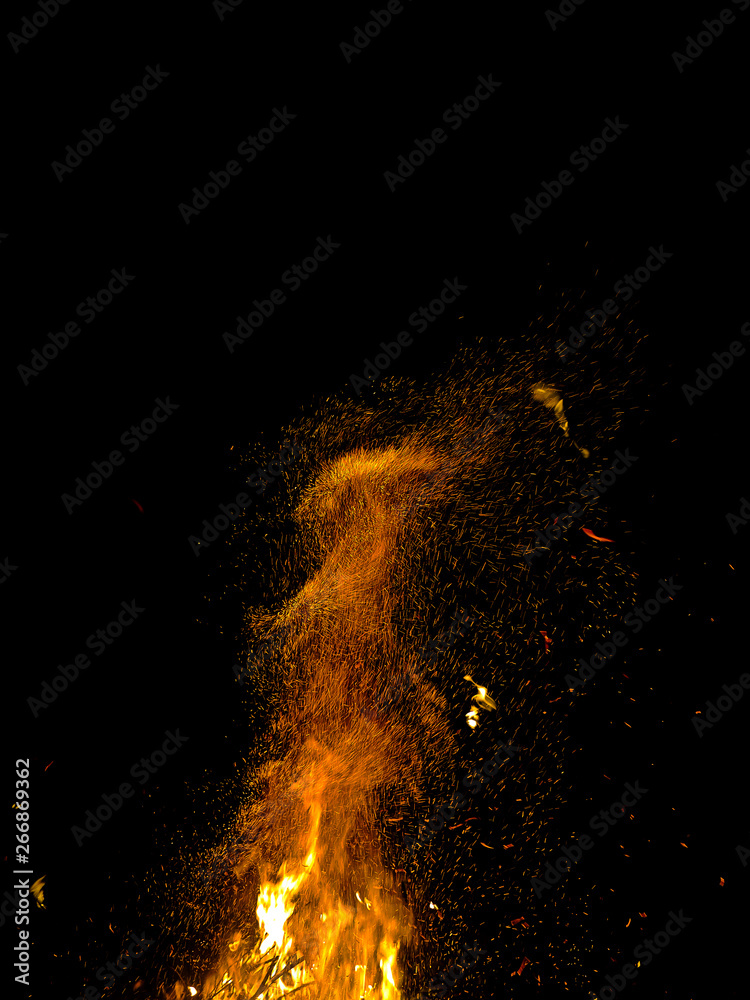 bright wild sparks of a burning campfire jumping on a black background at night bright wild sparks of a burning campfire jumping on a black background at night