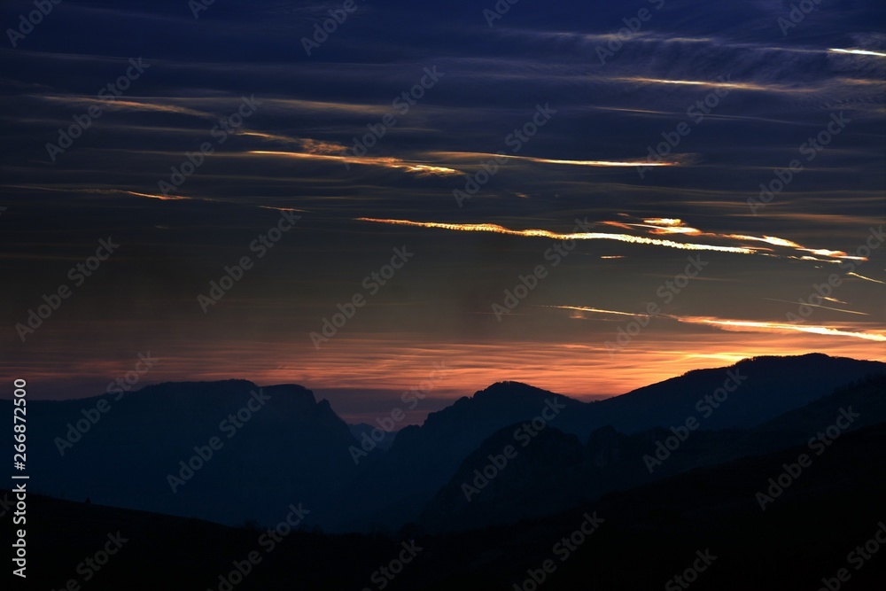 the silhouettes of the Carpathian mountains at sunset the silhouettes of the Carpathian mountains at sunset