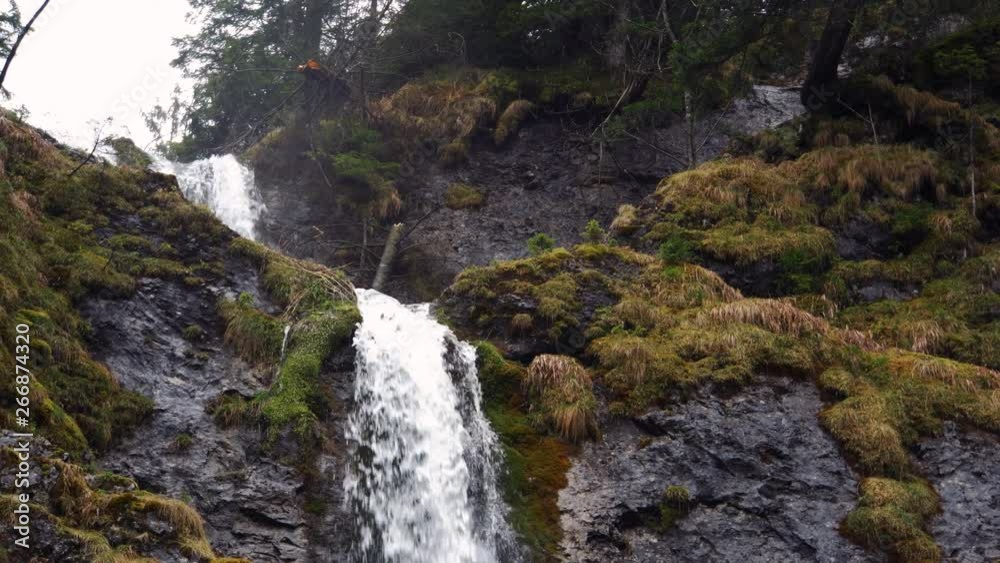 Closeup pan showing a waterfall during fall in the Zakopane mountains in Poland. Closeup pan showing a waterfall during fall in the Zakopane mountains in Poland.