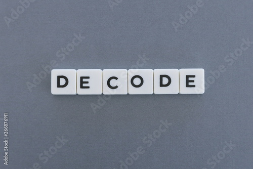 Decode word made of square letter word on grey background.