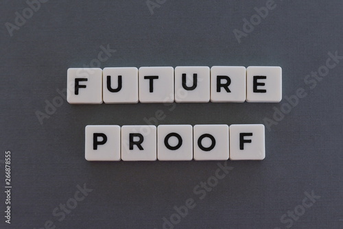 Future proof word made of square letter word on grey background.