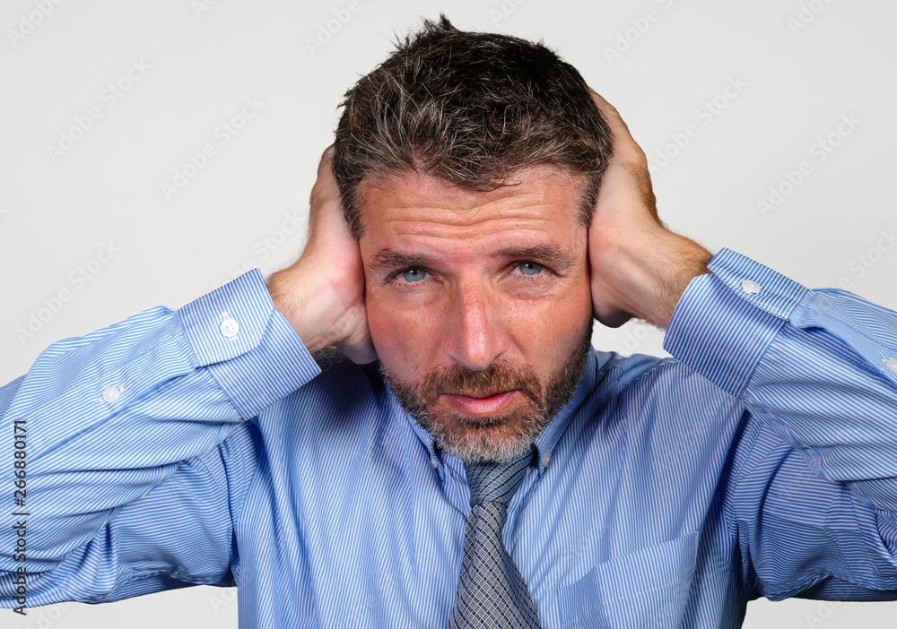 businessman in shirt and necktie suffering depression problem feeling tired and overwhelmed isolated on white background in company business stress