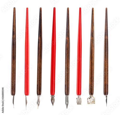red and brown penholders with various nibs