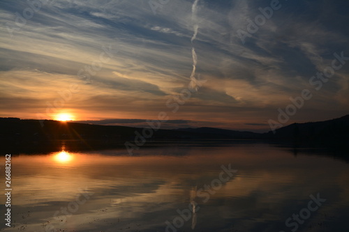 a beautiful sunset on the lake 