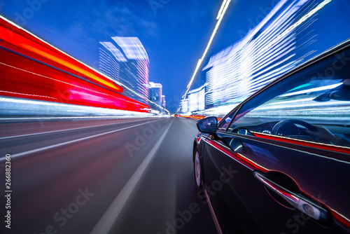 View from Side of Car moving in a night city