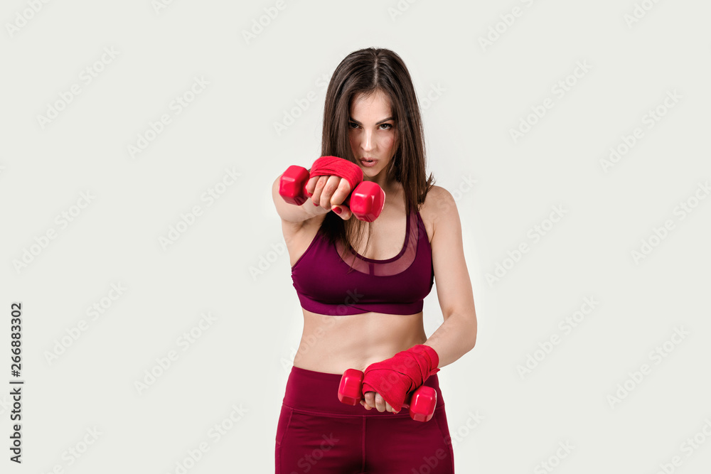 beautiful woman doing exercise for arms with red dumbell beautiful woman doing exercise for arms with red dumbell