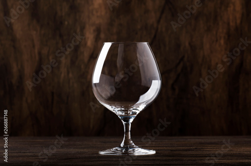 Empty brandy or cognac glass, copy space, selective focus