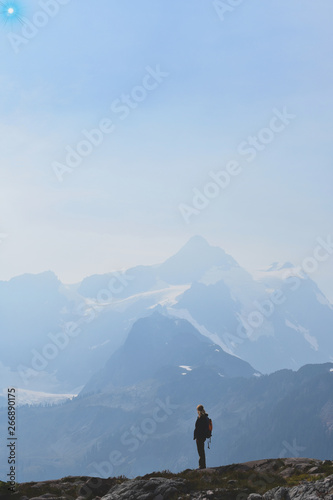 man on top of mountain