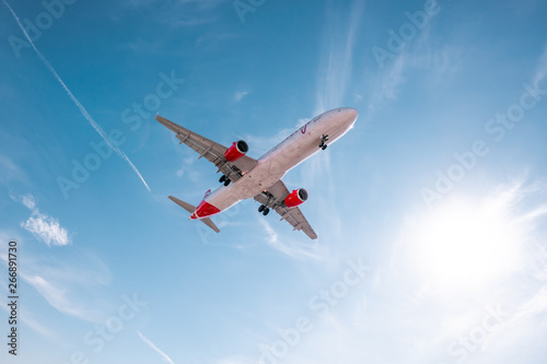 Aviation  travel  air transportation concept. Airplane in blue sky