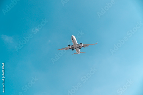 Travel by plane, aviation concept. Airliner in blue sky