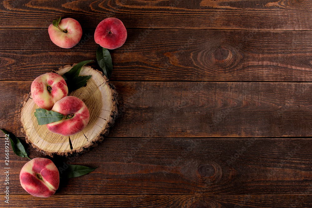composition of many varieties of peach on a brown wooden background. fruits. composition of many varieties of peach on a brown wooden background. fruits.