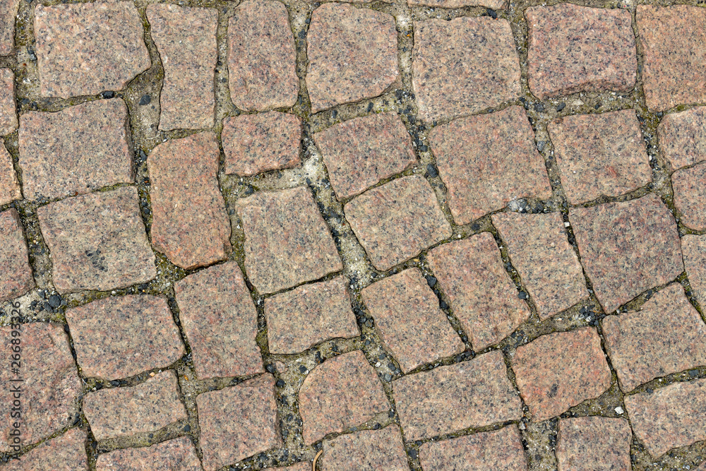 Texture of brown granite paving slabs Texture of brown granite paving slabs