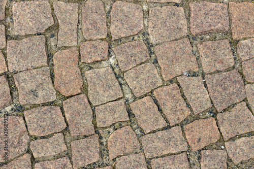 Texture of brown granite paving slabs