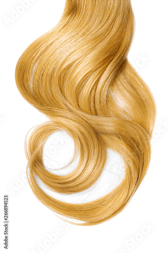 Long wavy blond hair isolated on white background. Ponytail