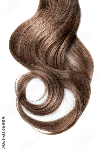 Long wavy brown hair on white background. Ponytail