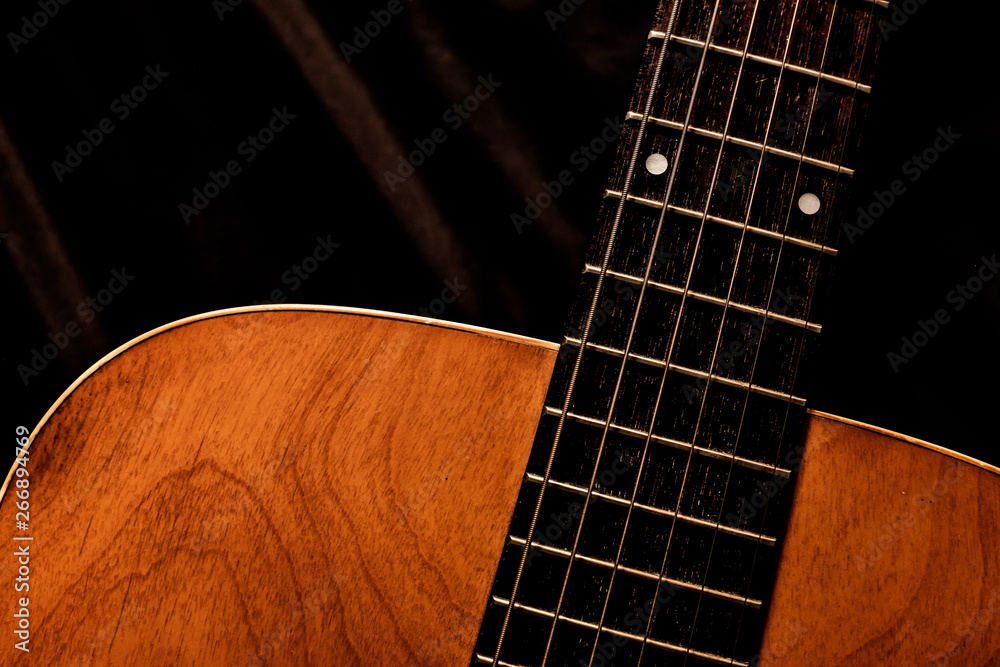 Obraz premium acoustic guitar on a black background