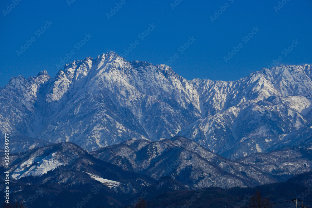 Tateyama Mountain Range seen from Toyama Plain in Japan.  Mt, turugidake.　富山平野から見た立山連峰　剱岳