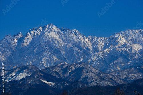 Tateyama Mountain Range seen from Toyama Plain in Japan. Mt, turugidake. 富山平野から見た立山連峰 剱岳