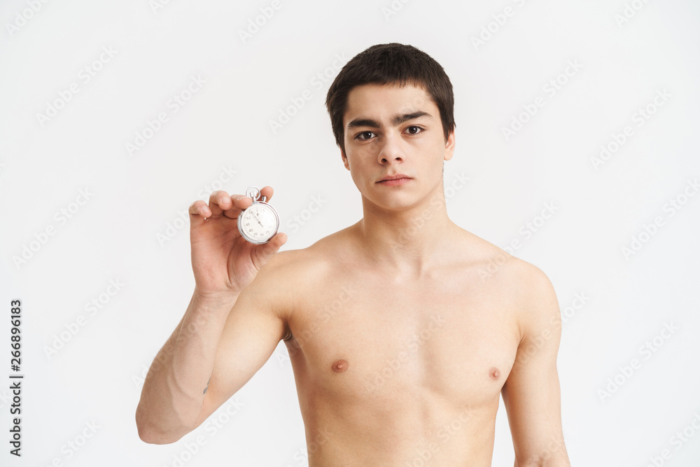 Confident fit young shirtless sportsman