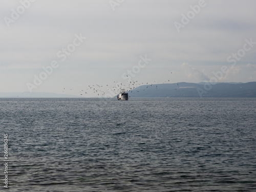 Traditional wooden fishing boat on sea