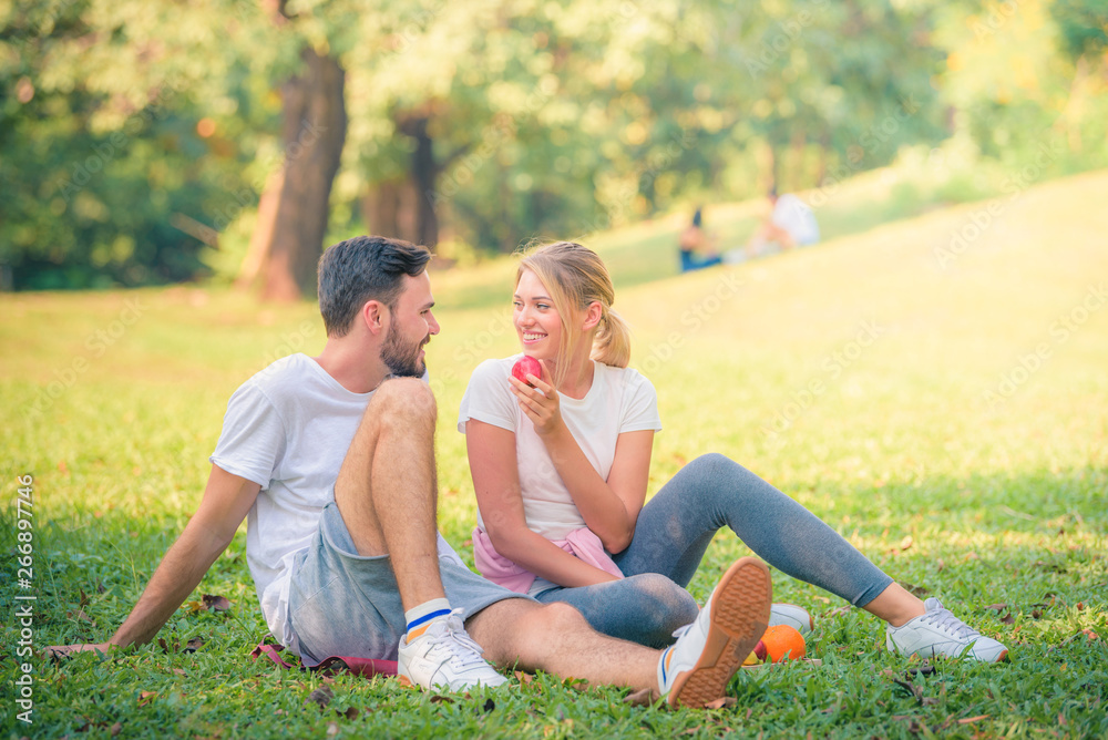 Portrait image of Young couple enjoying in the park at sunset. Concept romantic and love. Warm tone. Portrait image of Young couple enjoying in the park at sunset. Concept romantic and love. Warm tone.