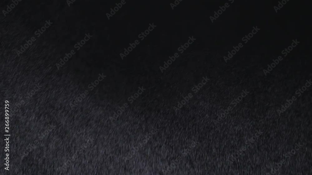 White exploding powder over black background White exploding powder over black background