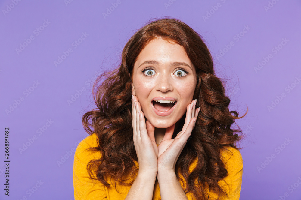 Portrait of a pretty young redheaded woman standing Portrait of a pretty young redheaded woman standing