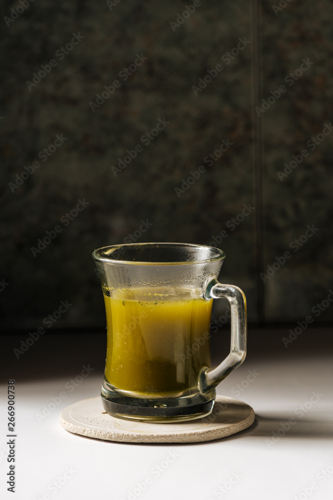 Hot matcha tea in transparent cups Hot matcha tea in transparent cups