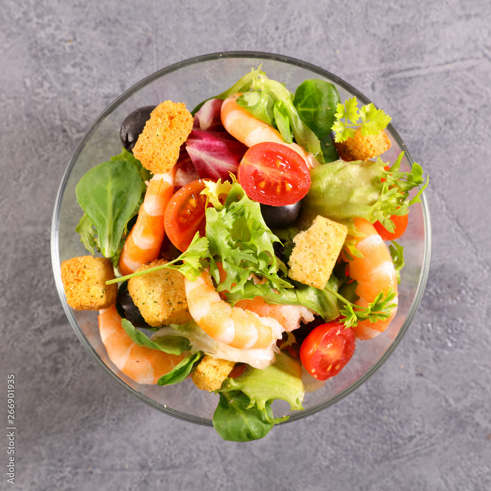 bowl of shrimp salad with tomato, olive and crouton bowl of shrimp salad with tomato, olive and crouton