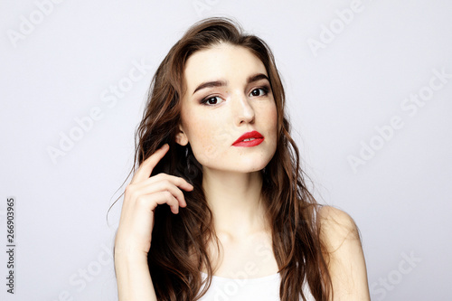 lifestyle, beauty and people concept: Young cute smiling girl over white background