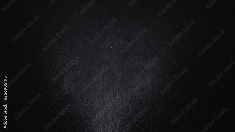 White exploding powder over black background White exploding powder over black background