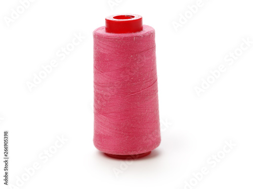 spools of thread for the textile industry on white background